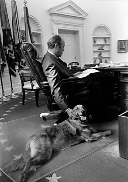 Gerald R. Ford with his dog Liberty in the Oval Office