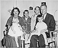 H0002-1. Gerald R. Ford, Jr., and Betty Ford sit for a family portrait with their children Susan Ford, Jack Ford, Michael Ford, Steven Ford. 1959.