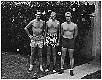 H0059-3. Gerald R. Ford, Jr. and two unidentified men stand in bathing suits on a sidewalk, possibly during naval training in Chapel Hill, NC. 1943.