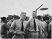 H0061-2 and H0061-3. Gerald R. Ford, Jr. and fellow officer Truman Walling at the farewell party for Air Group Thirty at the Ford Island Tennis Club, Pearl Harbor. May 12, 1944.