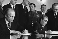 Following their bilateral talks, President Ford and Soviet General Secretary Leonid I. Brezhnev sign a joint communique on the limitation of strategic offensive arms in the Conference Hall of the Okeansky Sanitorium, Vladivostok, USSR.  