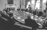 President Ford briefs the Republican Congressional Leadership on the situation in Indochina. Defense Secretary James Schlesinger and Secretary of State Henry Kissinger are seated at the far end of the table.  Cabinet Room.  April 22, 1975.  