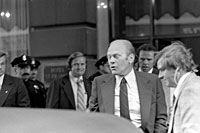 A6521-22A	President Ford winces at the sound of the gun fired by Sarah Jane Moore during the assassination attempt in San Francisco, California.  