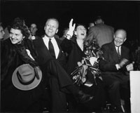 Congressman Gerald Ford and wife Betty attend a Grand Rapids campaign event with presidential candidate Dwight D. Eisenhower and his wife Mamie. October 1, 1952. 