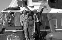 President Ford, vice presidential running mate Senator Robert Dole and Mrs. Elizabeth Dole debark Marine I to attend a campaign rally in the Senator’s hometown. Russell, Kansas. August 20, 1976.