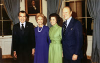 President and Mrs. Richard Nixon with Gerald and Betty Ford in the Blue Room of the White House following Representative Ford's nomination to succeed Spiro T. Agnew as Vice President. October 13, 1973. 