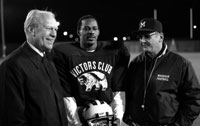 President Ford with University of Michigan football coach Bo Schembechler and All-American receiver Anthony Carter during a visit to Ann Arbor. November 10, 1982. 