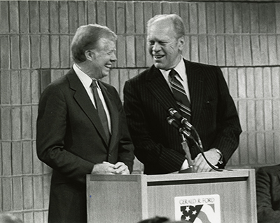 Former Presidents Jimmy Carter and Gerald R. Ford co-host an All-Democracies Conference, bringing together leaders from 44 democracies worldwide, at the Gerald R. Ford Library in Ann Arbor, Michigan.  February 9, 1983.  