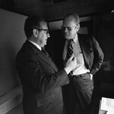 A2093-03. President Ford and Secretary of State Henry  Kissinger confer on the train ride to Vladivostok. November 23, 1974.