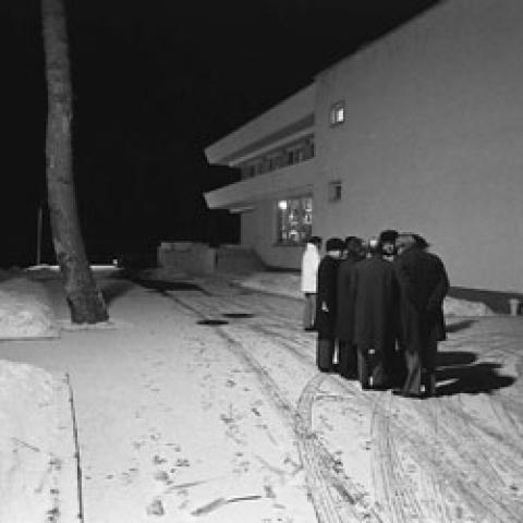 A2093-24. President Ford and his aides discuss negotiating strategy outdoors, in ‑20 degree weather, for fear of being electronically monitored by their Russian hosts.  November 23, 1974.