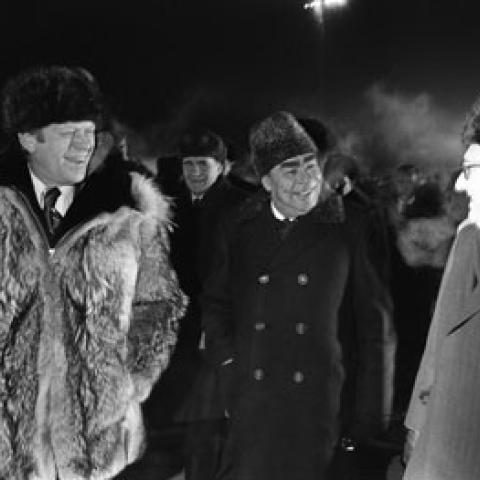 A2097-26. Just moments after this photo was taken, President Ford informally concluded the Vladivostok summit by giving his wolfskin coat to Secretary Brezhnev on the tarmac at Vozdvizhenka  Airport.  November 24, 1974.