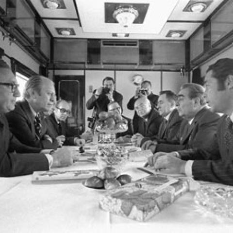 A2107-29A. President Ford, Secretary of State Henry Kissinger and other U.S. representatives meet with General Secretary Brezhnev, Foreign Secretary Gromyko, Ambassador Dobrynin, and others aboard a Russian train headed for Vladivostok, USSR.   November 23, 1974. 