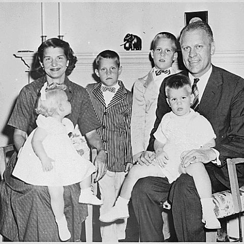 H0002-1. Gerald R. Ford, Jr., and Betty Ford sit for a family portrait with their children Susan Ford, Jack Ford, Michael Ford, Steven Ford. 1959.