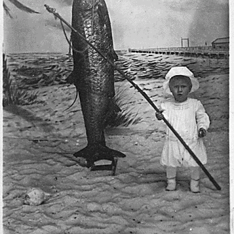 H0020-4. Gerald R. Ford, Jr. (then known as Leslie Lynch King, Jr.) holding a fishing rod, poses for portrait. February 1915.