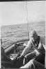 H0037-4. Gerald R. Ford, Jr. mans the tiller on a sailboat, probably on Lake Michigan near Ottawa Beach (site of his parent's summer cottage). 1940.