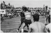 H0059-4. Lieutenant Commander Gerald R. Ford, Jr. watches a boxing match on the flight deck of the USS MONTEREY. Mr. Ford was the ship's athletic director. 1944.