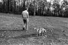 A1633-10. President Ford and his dog Liberty walk the grounds of Camp David. October 26, 1974.