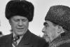 A2102-06. President Ford dons a Russian wool cap upon his arrival in Soviet Union, shown here with Soviet General Secretary Leonid Brezhnev at Vozdvizhenka Airport, Vladivostok, USSR.  November 23, 1974.