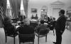 A4266-27. Secretary of State Henry Kissinger interrupts a meeting with senior advisers to relay the latest information on the U.S. evacuation of Saigon.  April 29, 1975
