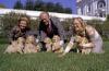 A7182-22A. President and Mrs. Gerald R. Ford and daughter Susan play with Liberty’s golden retriever puppies on the South Lawn of the White House. November 5, 1975.