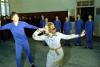 A7545-20A. While touring the Central May 7th College of Art in Peking, People's Republic of China, First Lady Betty Ford shares a dance move with one of the students. December 3, 1975