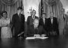 B1030-12A. President Ford signs S.3735, authorizing the 1976 National Swine Flu Immunization Program.  August 12, 1976. 
