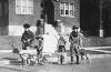 H0023-04. Gerald R. Ford, Jr., Carl Engel, Tom Ford, and an unidentified boy pose with their pioneer wagon after winning first prize in the Boys Day Parade. 1923.