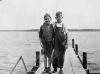 H0028-03. Gerald R. Ford, Jr. and his cousin Gardner James display the day's catch from a dock, Delavan Lake, WI. 