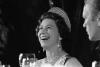 B0594-05A. Queen Elizabeth II laughs during a state dinner held in her honor.  July 7, 1976.