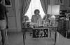 A5314-22. First Lady Betty Ford works at her desk in the East Wing, where a “Don’t Tread on Me” Equal Rights Amendment doormat hangs from the front of her desk.  June 30, 1975. 