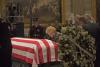 2007-NLF-043. With her four children behind her Mrs. Ford pauses at the casket of her husband of fifty-eight years during funeral events for President Ford at the U.S. Capitol. January 1, 2007.