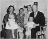 H0007-2. The Ford family poses in front of the fireplace at 514 Crown View Drive, Alexandria, VA. 1959.