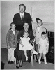 H0008-1. The Ford family poses in front of the fireplace at 514 Crown View Drive, Alexandria, VA. 1959.