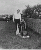 H0042-2. Gerald R. Ford, Jr., and Steven Ford cut the lawn in the back yard of the Ford residence at 514 Crown View Drive, Alexandria, VA. 1960.