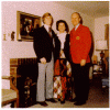 H0072-2. Mike Ford poses with his parents in front of the fireplace in the living room of the family residence at 514 Crown View Drive, Alexandria, VA. December 1972.