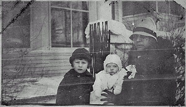 H0017-1. Mrs. Gerald R. Ford, Sr. holds infant Richard Ford while Thomas Ford sits close by. 1924.
