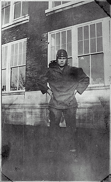 H0022-1. Gerald R. Ford Jr., poses in his Grand Rapids South High School football uniform. 1930.