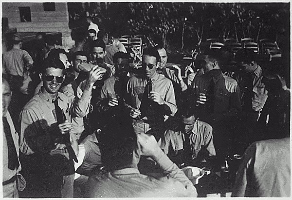 H0060-1. Naval Officers take a break at an officer's club on a Pacific Island. 1943.