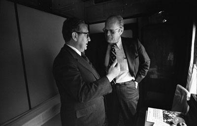 A2093-03. President Ford and Secretary of State Henry  Kissinger confer on the train ride to Vladivostok. November 23, 1974.