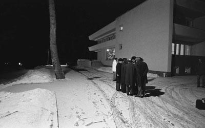 A2093-24. President Ford and his aides discuss negotiating strategy outdoors, in ‑20 degree weather, for fear of being electronically monitored by their Russian hosts.  November 23, 1974.