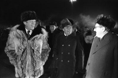 A2097-26. Just moments after this photo was taken, President Ford informally concluded the Vladivostok summit by giving his wolfskin coat to Secretary Brezhnev on the tarmac at Vozdvizhenka  Airport.  November 24, 1974.