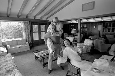 A3503-07 - President and Mrs. Ford and Susan engage in a little family horseplay at Camp David. March 2, 1975.