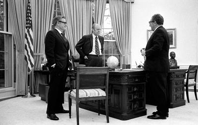 A4241-27A - President Ford meets in the Oval Office with Secretary Kissinger and Vice President Rockefeller to discuss the American evacuation of Saigon. April 28, 1975.