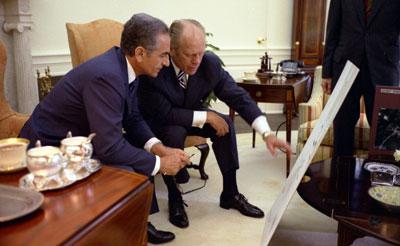 A4573-18A. President Ford and the Shah of Iran, Mohammad  Reza Pahlavi, look at charts related to the USS Mayaguez military operation  earlier that month, during the State Visit of the Shah and Shahbanou, Farah  Pahlavi.Â