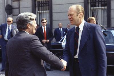 A4878-27. President Ford escorts Helmut Schmidt,  Chancellor of the Federal Republic of Germany, to his limousine after a  luncheon meeting at the American Embassy Residence.