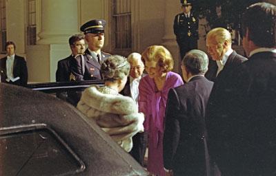 A6748-06A. First Lady Betty Ford greets Empress Nagako as she arrives at the White House with Emperor Hirohito of Japan for a state dinner in their honor on their historic first visit to the United States. October 2, 1975.