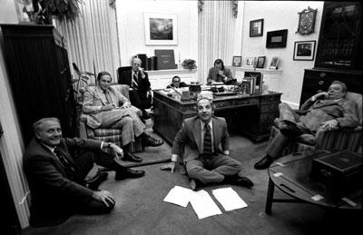 A6808-05. President Ford and staff watch a replay of his address to the Nation on recommendations for tax reduction and spending, televised earlier that evening. October 6, 1975.