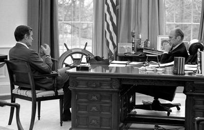 A7704-23 - President Ford meets with CIA Director-designate George Bush in the Oval Office. December 17, 1975.