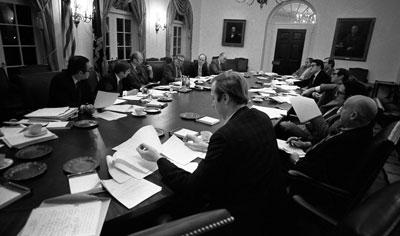 A7923-23. President Ford and his advisers listen to a comment by speechwriter Robert Hartmann at a nighttime meeting devoted to President Ford’s upcoming State of the Union speech. January 17, 1976.