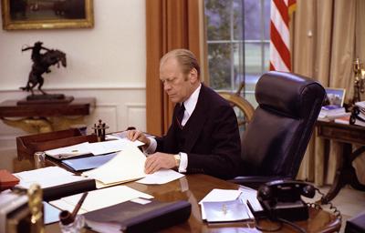 A8064-10A - President Ford at work in the Oval Office. January 27, 1976.